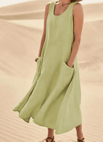 Comfortable sleeveless women's dress, elegant midi length. Loose fit design with convenient pockets, perfect for casual wear.