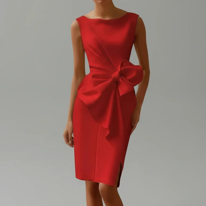 Stylish white sleeveless midi dress with elegant bow for women, great for special occasion or party wear.