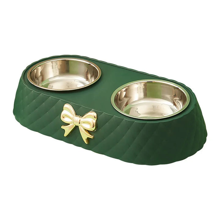 A pet enjoying a meal from an elegant stainless steel bowl, highlighting the product in use.