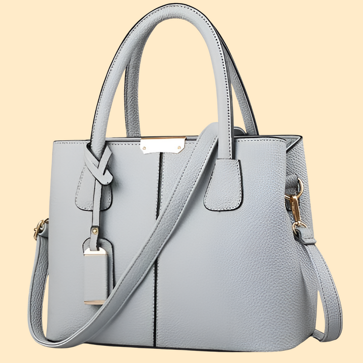 Stylish women's structured satchel handbag, an elegant fashion accessory perfect as a cross-body or shoulder bag.