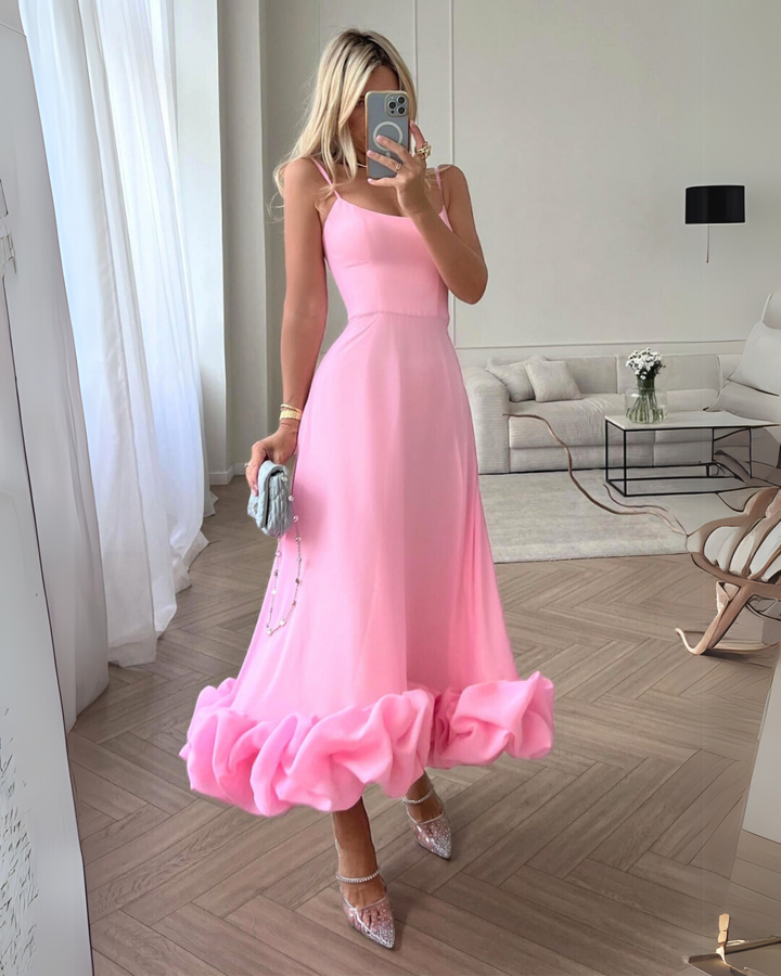 Elegant twirl dress, perfect for a wedding guest. Chic women's occasion wear with a flowy design.