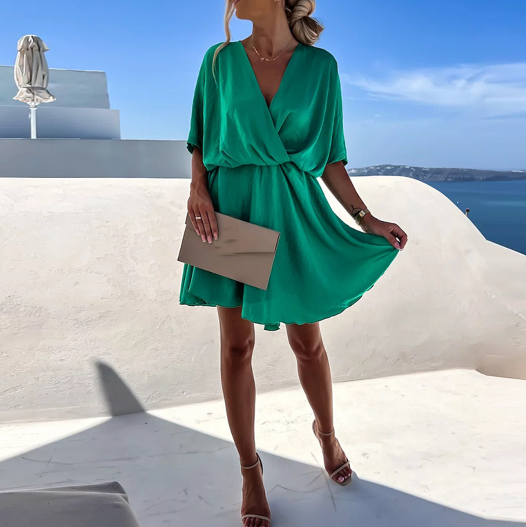 Versatile women's V-neck flowy mini dress, a chic wrap style for summer, party, or brunch fashion.