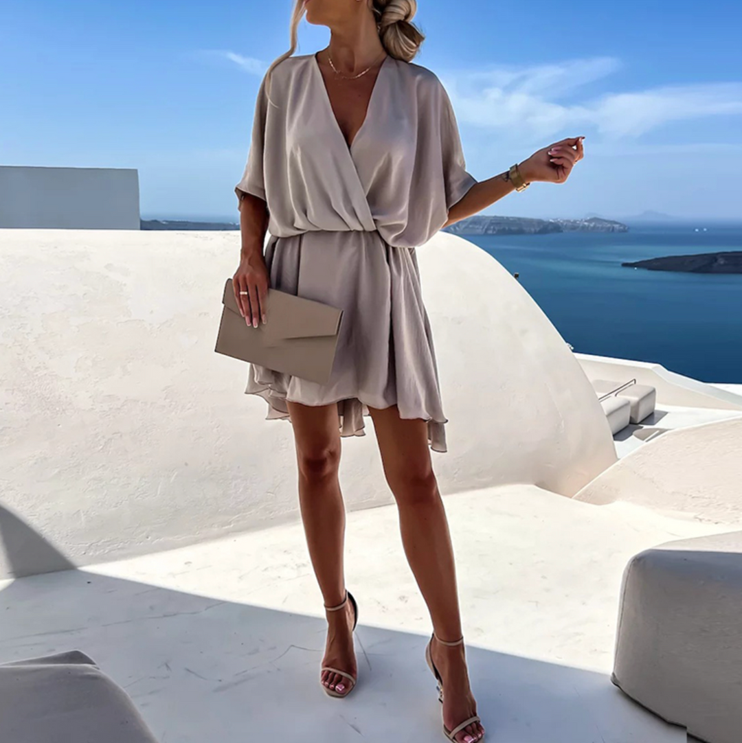 Comfortable women's elegant V-neck flowy wrap mini dress, perfect for summer vacation and brunches.