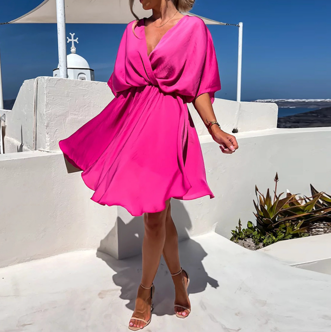 Chic women's summer mini dress, elegant V-neck flowy wrap design perfect for casual or party wear.