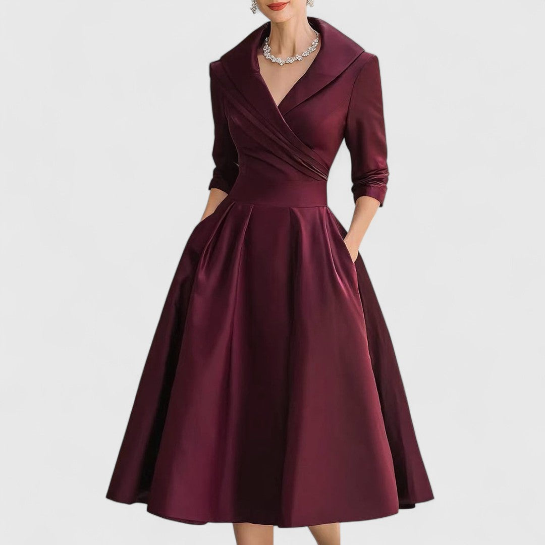 Flowy V-neck midi dress with 3/4 sleeves, an elegant & flattering formal or casual option.