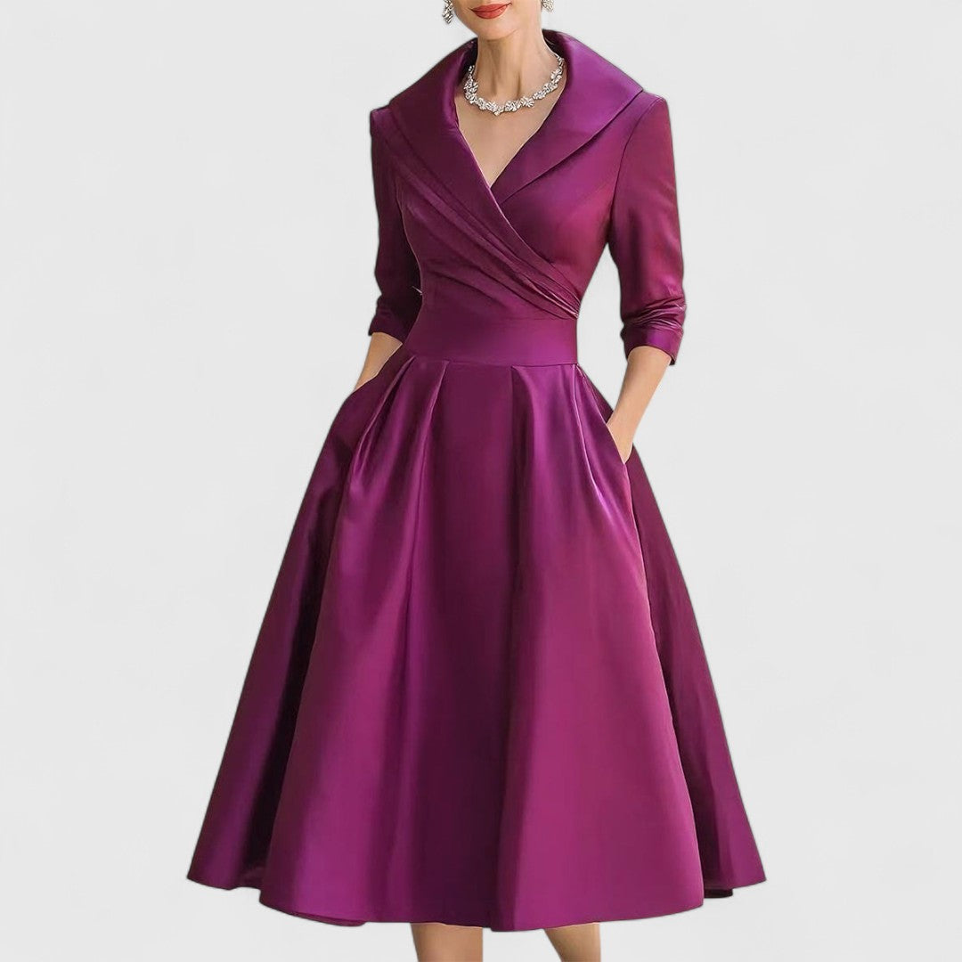 Women's sophisticated V-neck midi dress featuring 3/4 sleeves, ideal for any occasion.