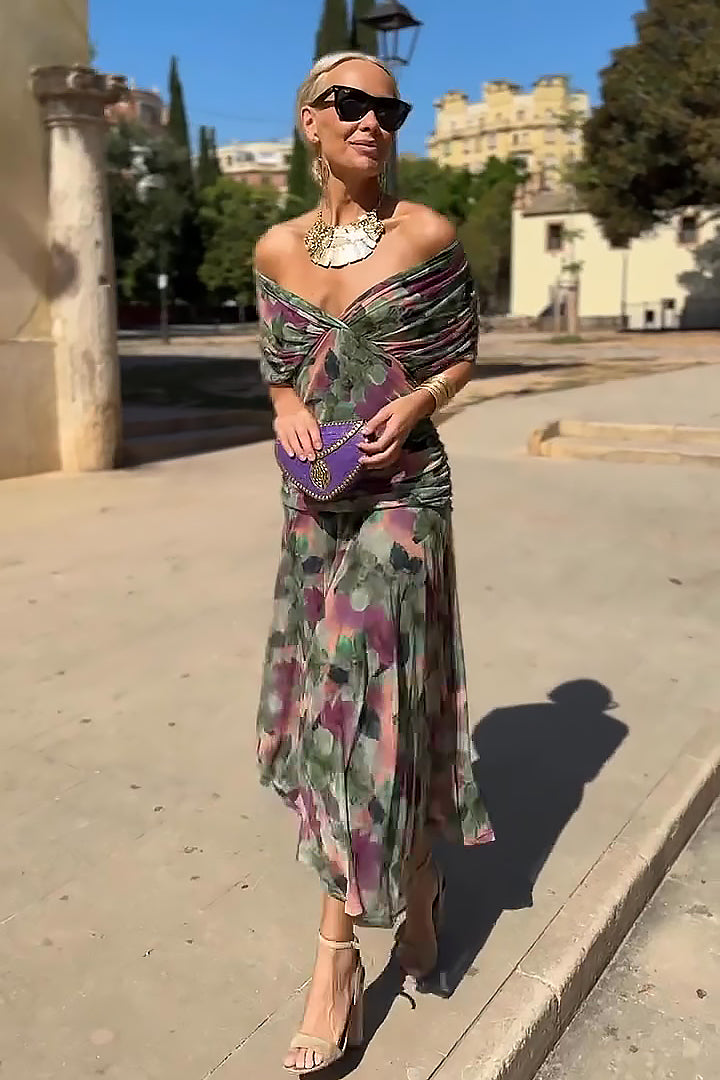 Flowing V-neck evening gown for women, featuring a sophisticated pleated waist, perfect for elegant events.