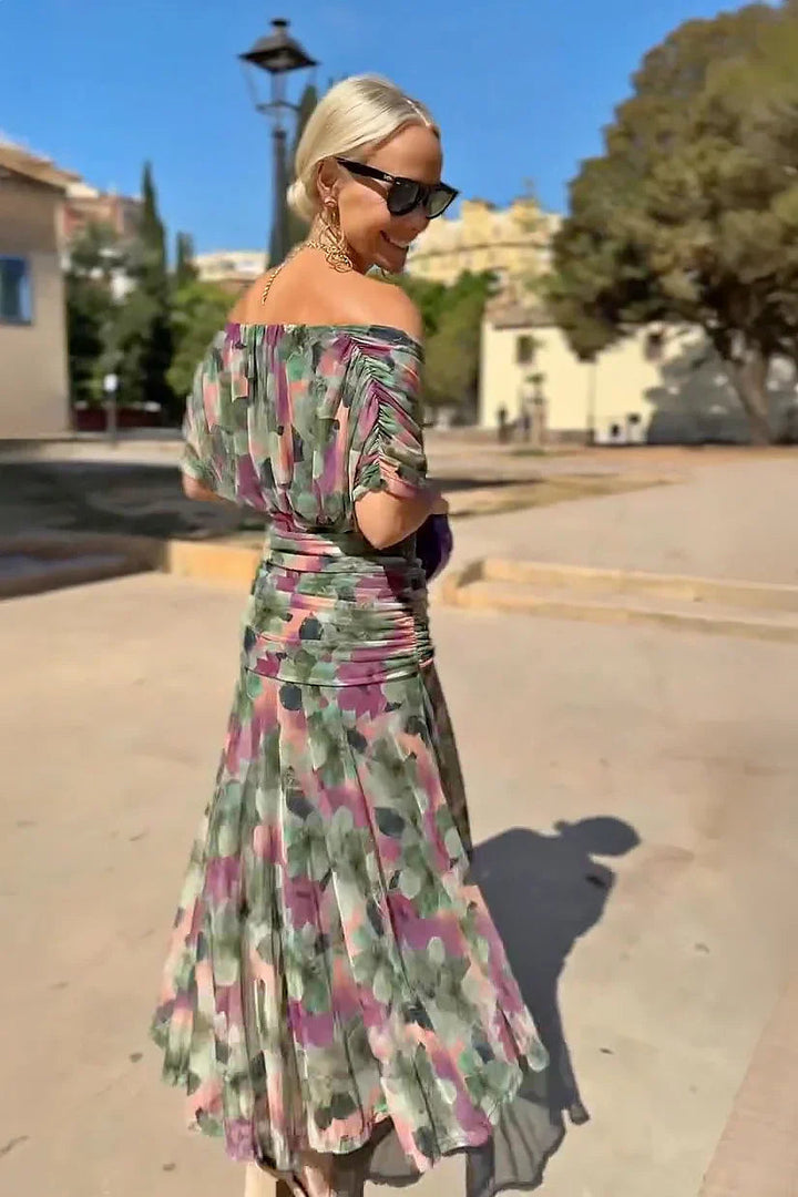 Women's elegant V-neck long dress, pleated waist and flowing sleeves, suitable for formal evening wear.