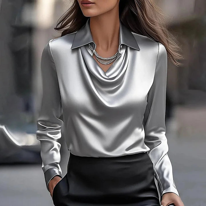 Chic women's shiny V-neck blouse, a dressy statement top. Elegant long sleeves for versatile fashion.