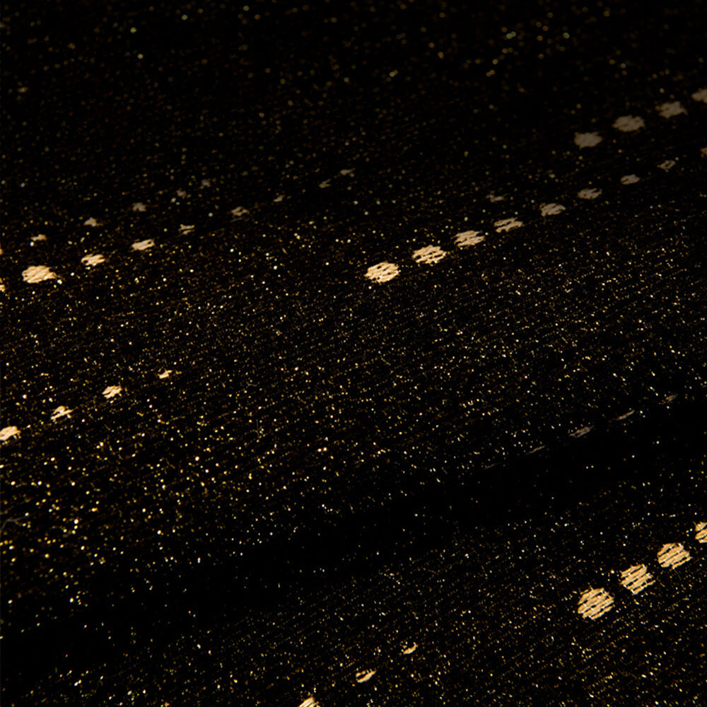 Detail of the non-slip backing on an elegant wavy chenille couch protector cover for secure fit.