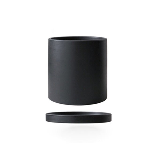 Contemporary ceramic plant pot with drainage saucer, for indoor use.