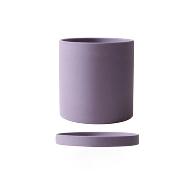 Elegant grey ceramic flowerpot with saucer, perfect for office or home.