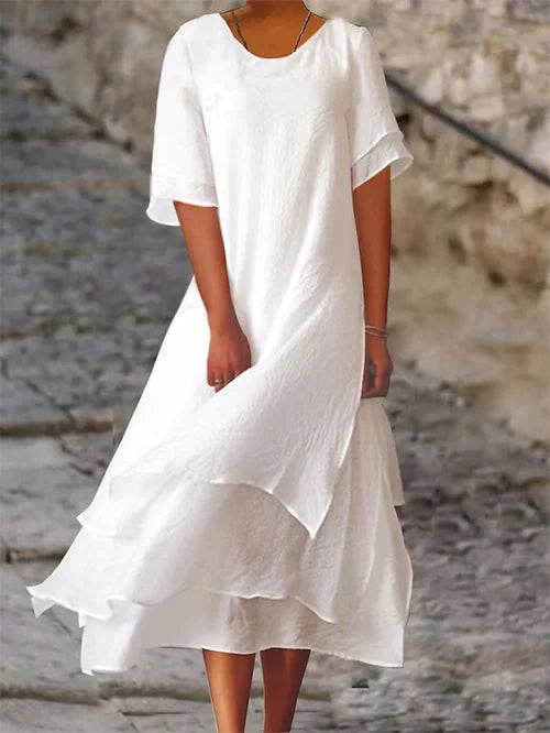 Elegant white flowy double-layer midi dress for women. Perfect summer casual or semi-formal wear, available in all sizes.