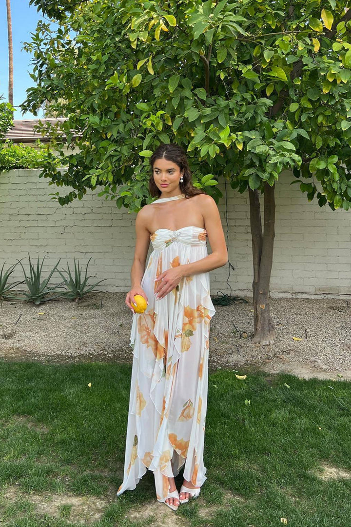 Elegant white halter maxi dress for women, perfect for summer vacations or beachwear, featuring a flowing silhouette.