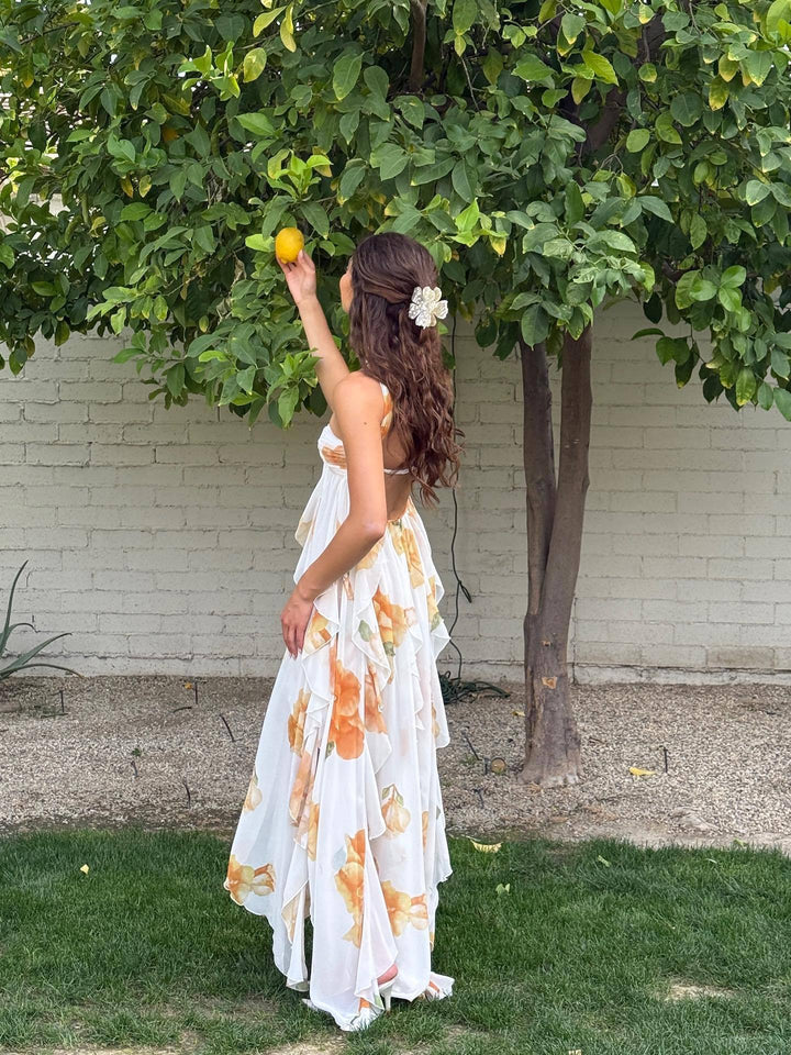 Flowy white sleeveless maxi dress for women, a versatile summer style for casual wear, beach, or resort vacations.