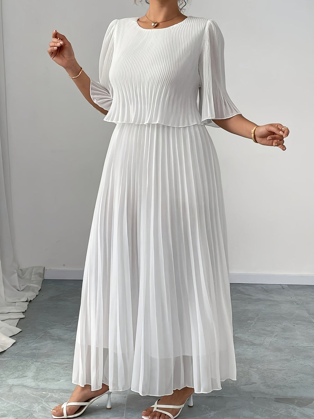 Stunning A-line white maxi dress with delicate pleats for women, a sophisticated choice for formal events.