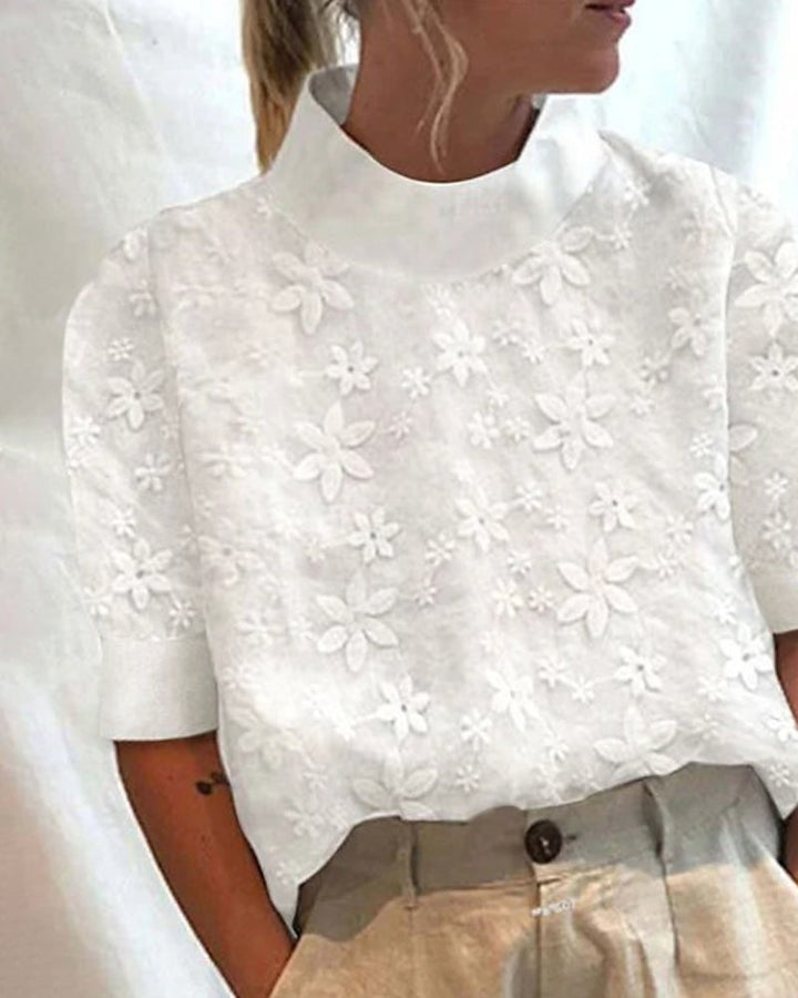 Elegant white women's blouse with a sophisticated stand collar, perfect for office or chic brunch outfits.