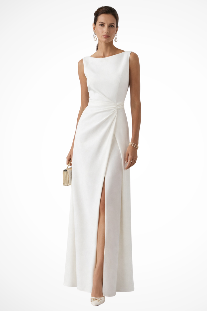 Elegant white women's evening maxi dress with graceful side slit, sleeveless design & draped waist for special occasions.