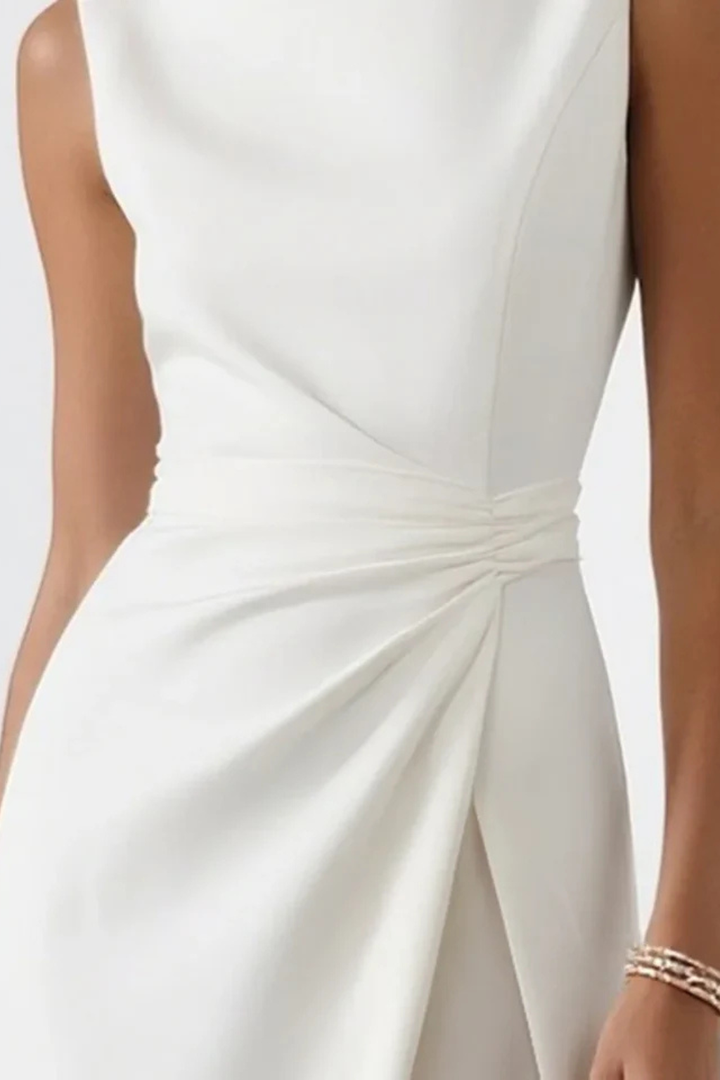 Beautiful white sleeveless evening gown for women, a formal maxi dress with a stylish side slit for special events.