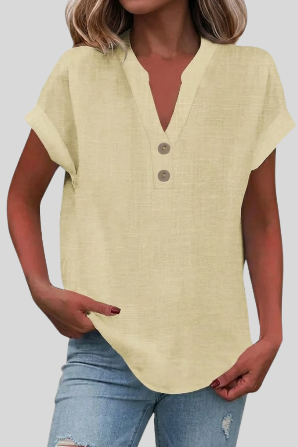 Women's short sleeve V-neck blouse in navy, styled with trousers. Perfect elegant work wear or office fashion.