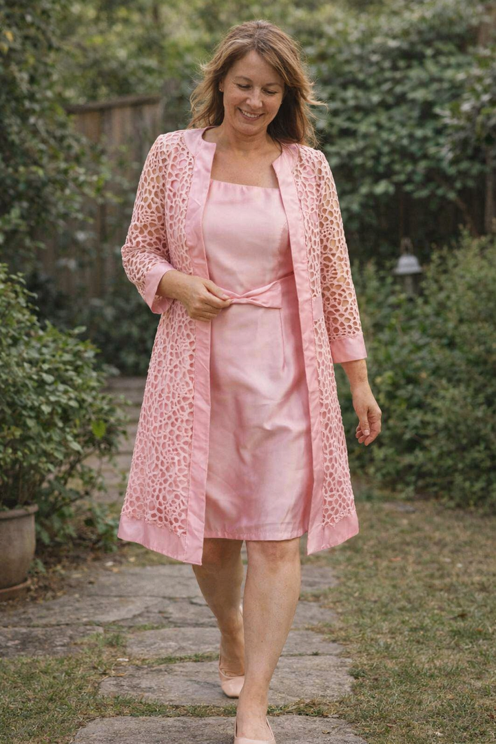 Elegant women's 2-piece dress and jacket set for special occasions. Perfect formal wear for parties.