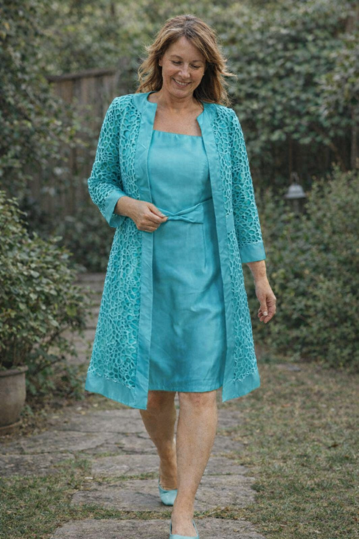 Modern women's fashion: a graceful two-piece dress and jacket set, suitable for formal parties.