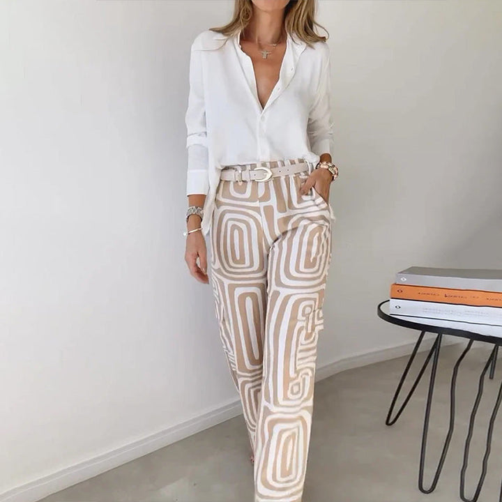 Modern women's elegant flowing top & patterned trouser set. Perfect 2-piece ensemble for business or dinner.