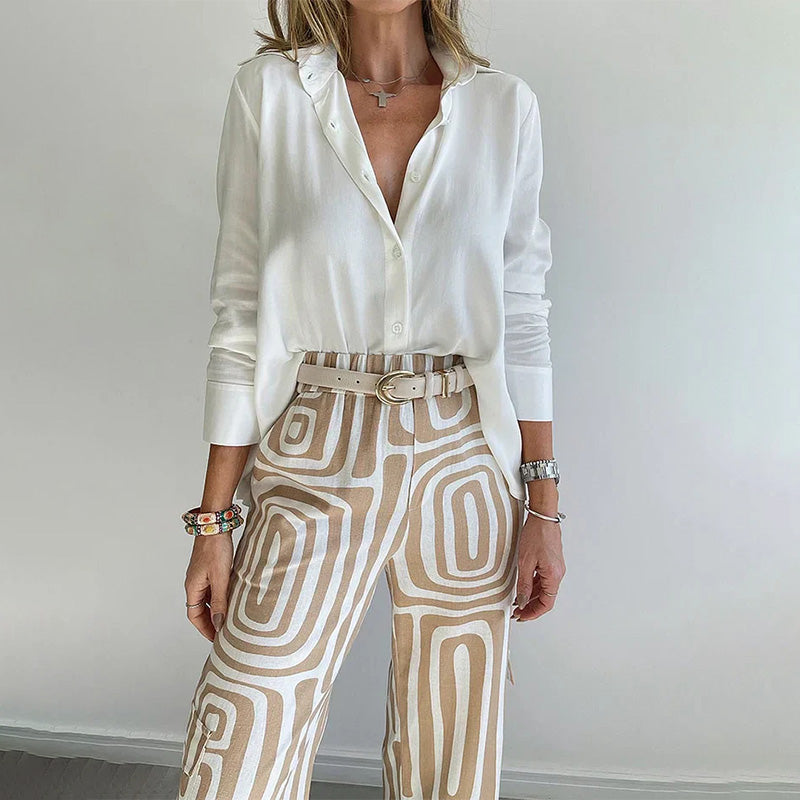 Graceful women's flowing tunic top & stylish patterned trousers set. A comfortable and chic two-piece ensemble.
