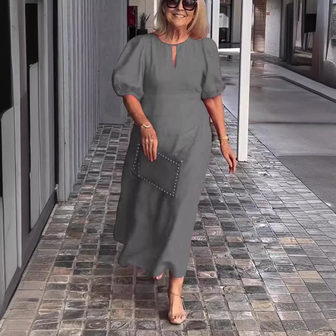 Women's formal wedding guest A-line midi dress with elegant puff sleeves & keyhole neckline. Perfect for special occasions.