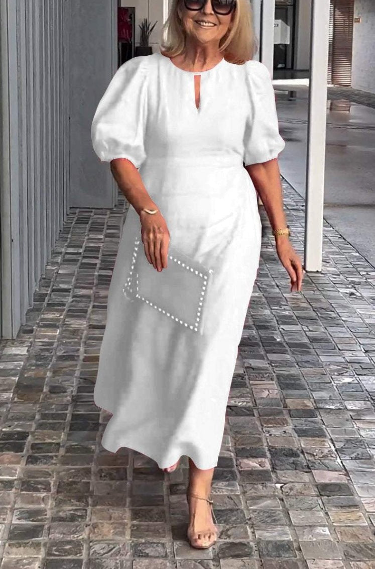 Comfortable elegant women's summer midi dress, puff sleeves, keyhole, A-line. Perfect for various occasions or parties.
