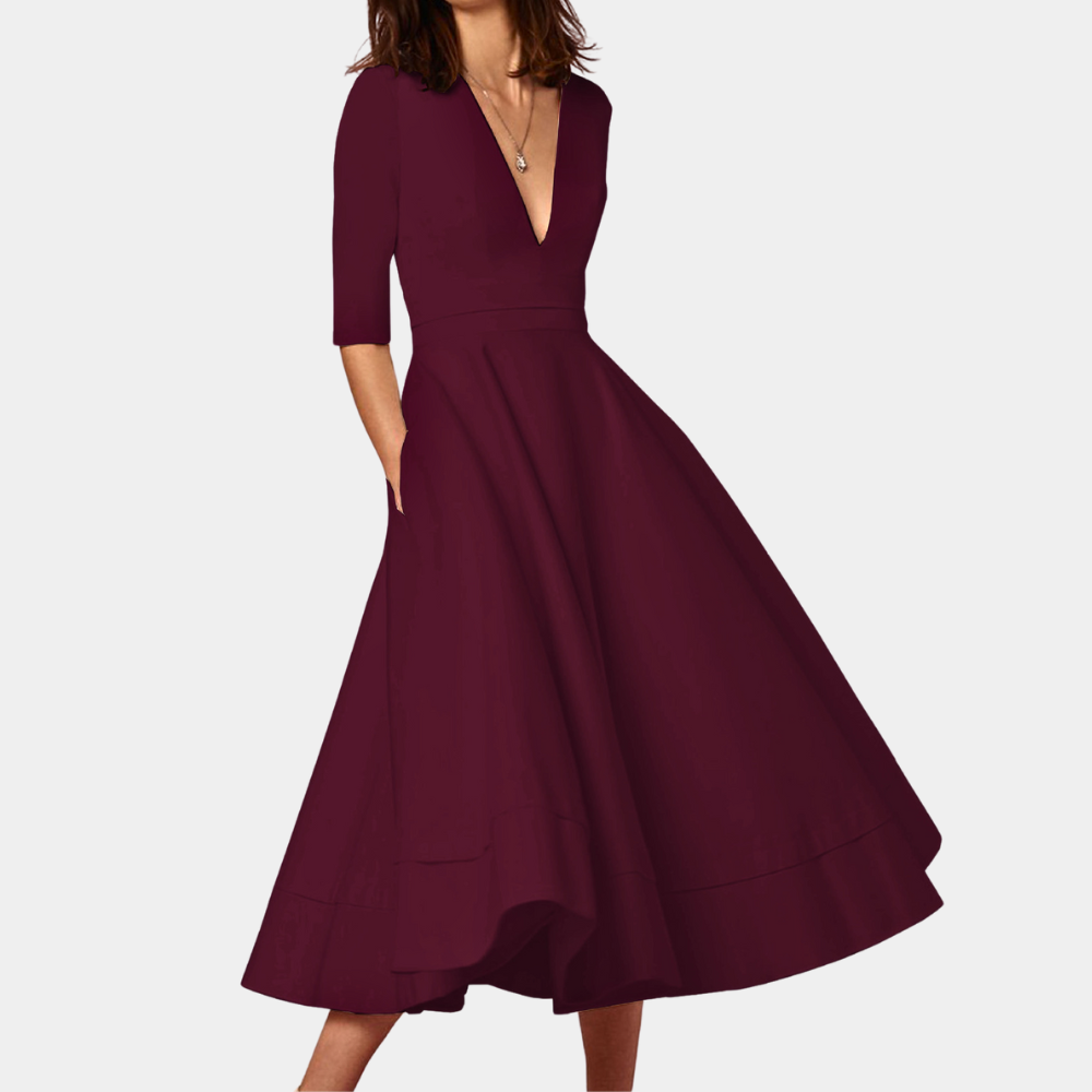 Sleeveless A-line midi dress for women with a side slit, offering a versatile and chic look. Spring/summer ready.
