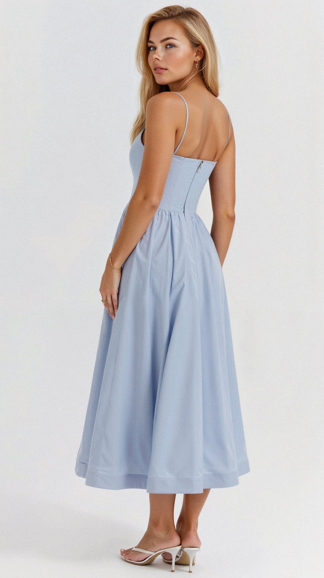 Sophisticated women's midi dress with an A-line silhouette and delicate spaghetti straps.