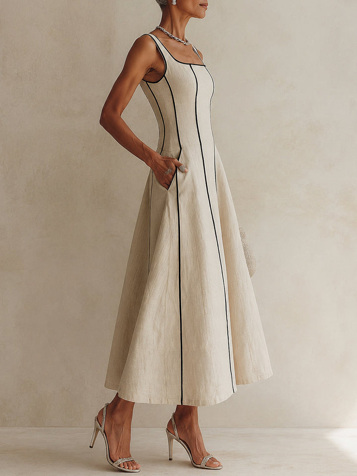 Women's elegant apricot maxi dress with a flattering A-line silhouette, square neck, and sophisticated piping.