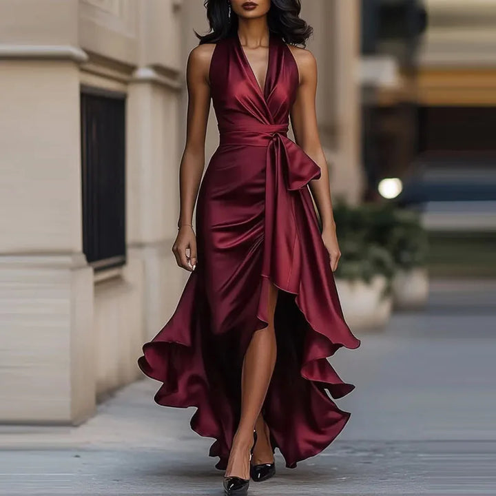 Women's elegant off-shoulder maxi dress with an asymmetrical hem. Flattering long formal evening gown for special occasions.