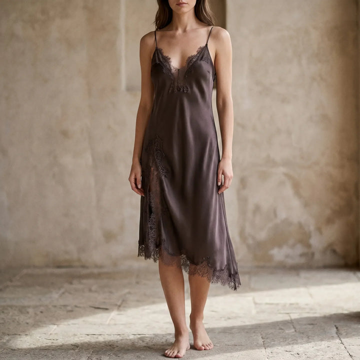 Elegant women's asymmetrical slip dress with a stylish v-neck and flowing midi length, perfect for evening wear.