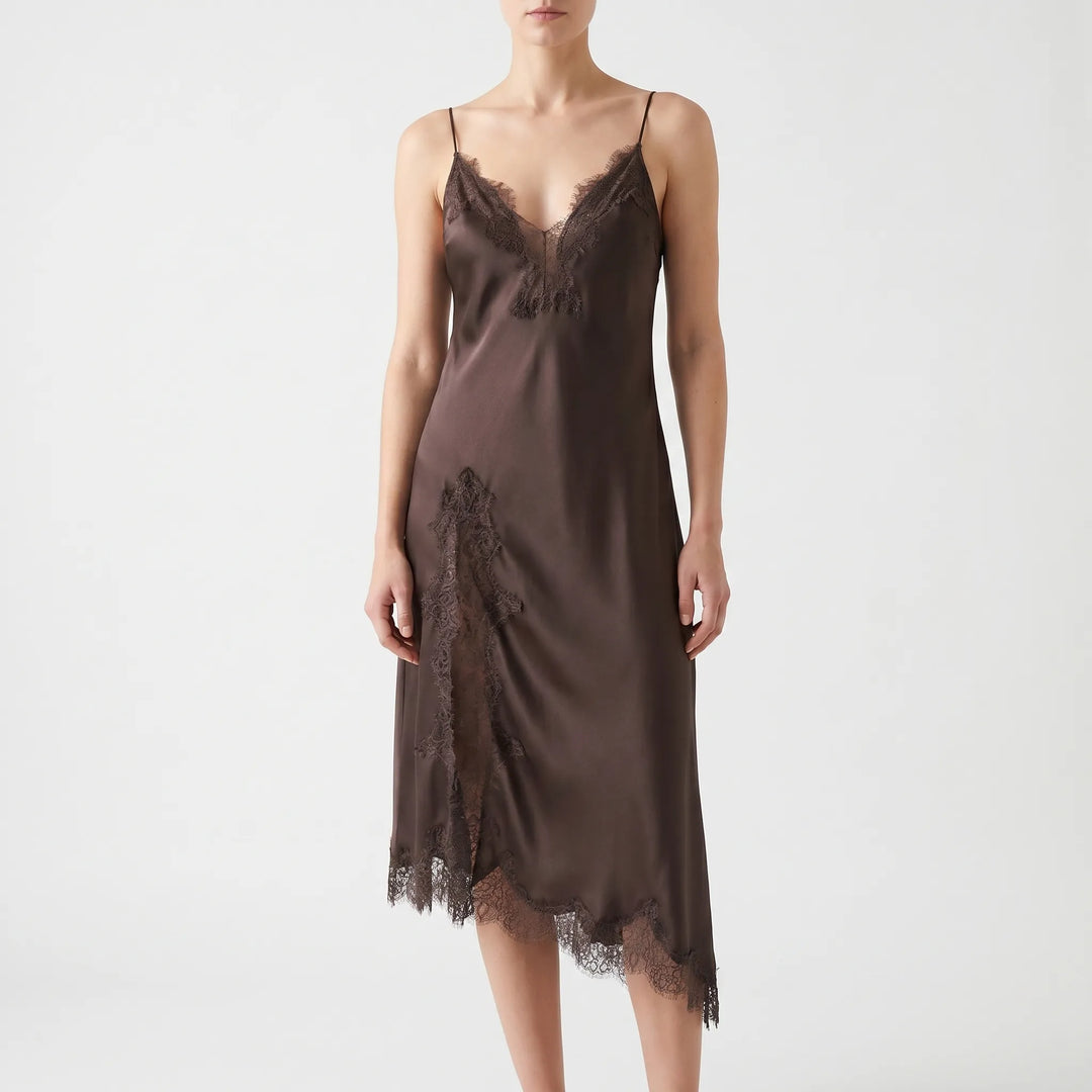 Stylish women's asymmetrical midi slip dress with a flattering v-neck, elegant lace detail, and unique hemline.