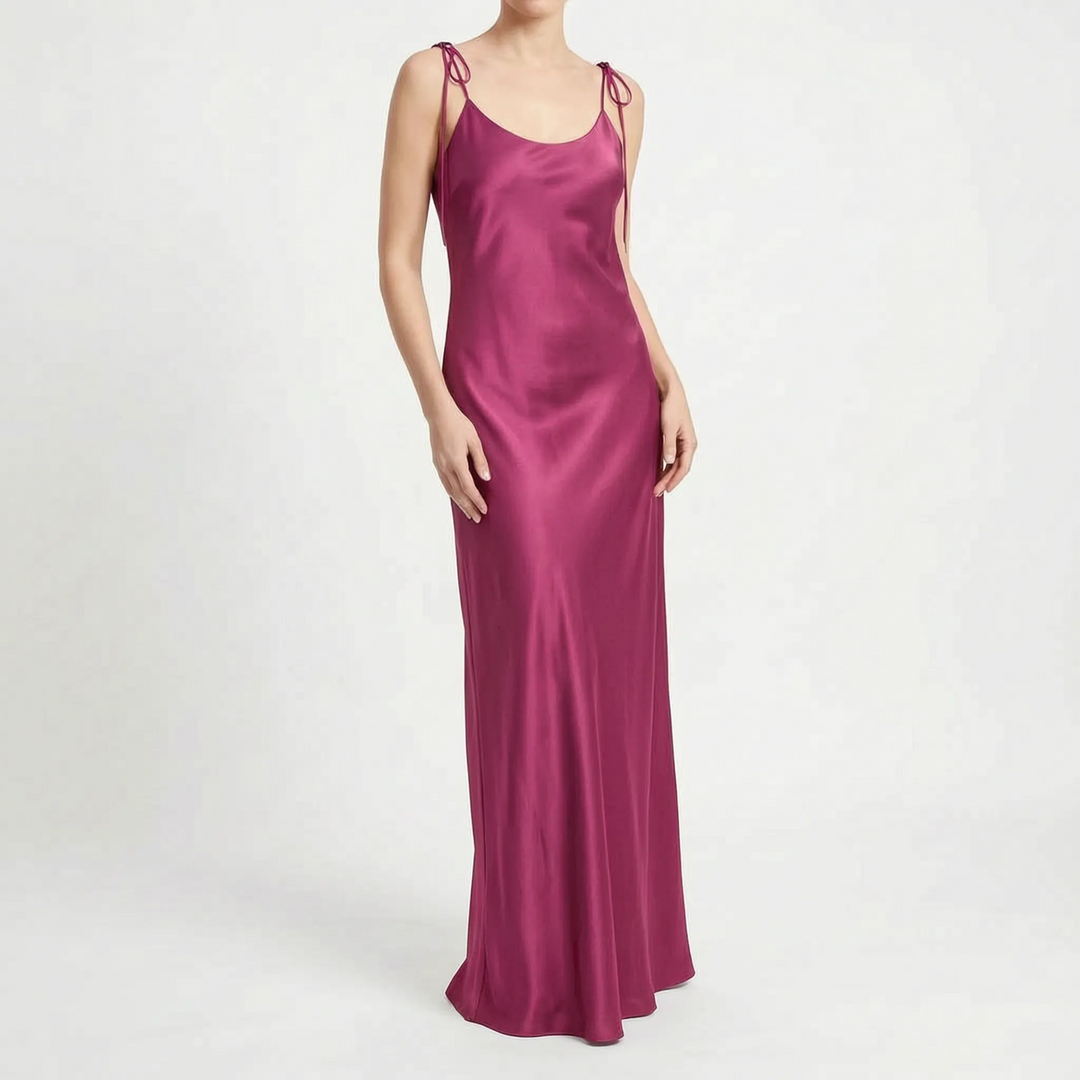 Flowing women's long slip dress, backless & floor-length, perfect for sophisticated party or formal occasions.