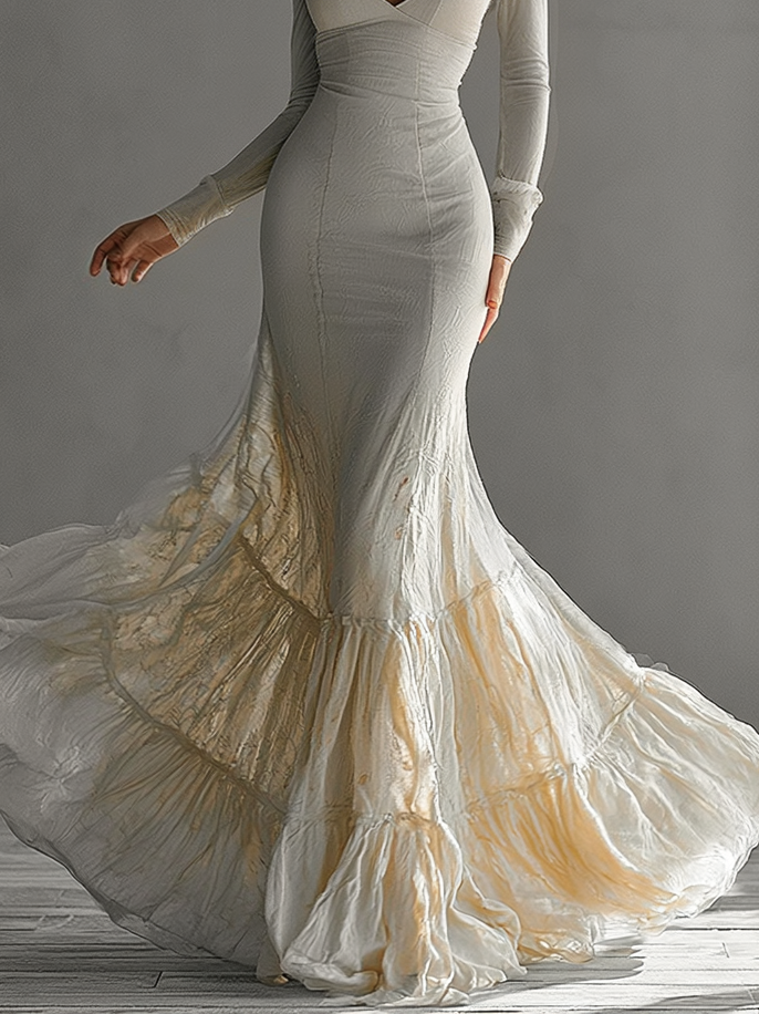 Chic women's beige long sleeve V-neck mermaid gown with flowing ruffle hem. Ideal formal dress for special occasions.