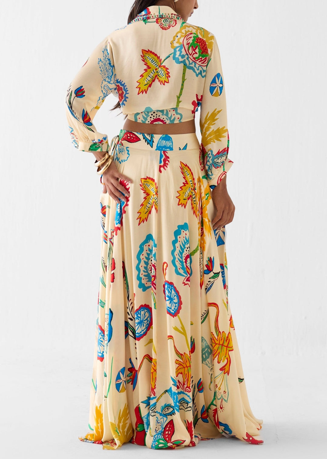 Stylish two-piece women's floral maxi skirt set with a tie-front top. Ideal vacation outfit or summer resort wear.