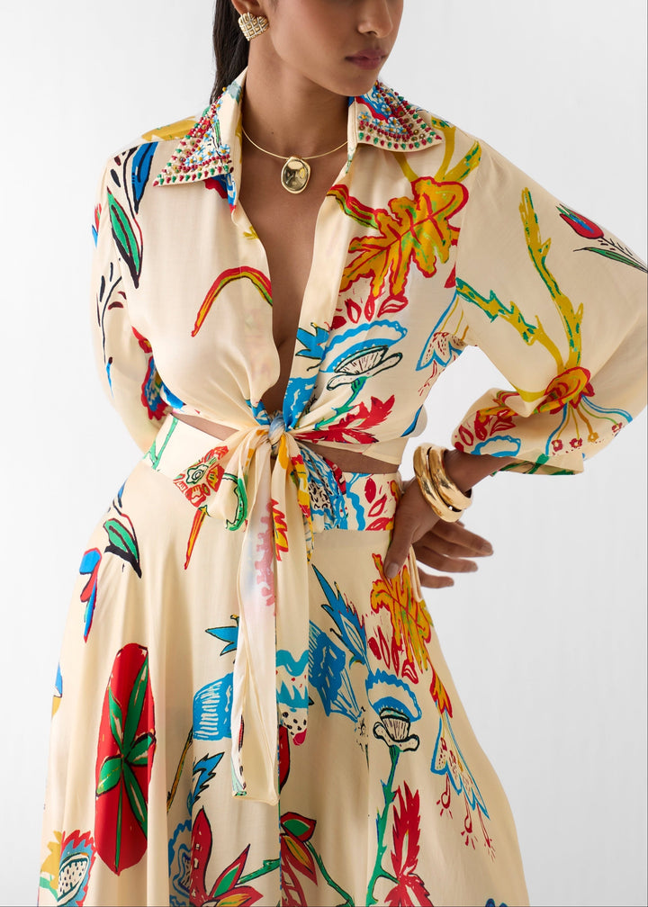 Women's beige floral print two-piece matching set: tie-front top & flowy maxi skirt. Elegant resort wear.
