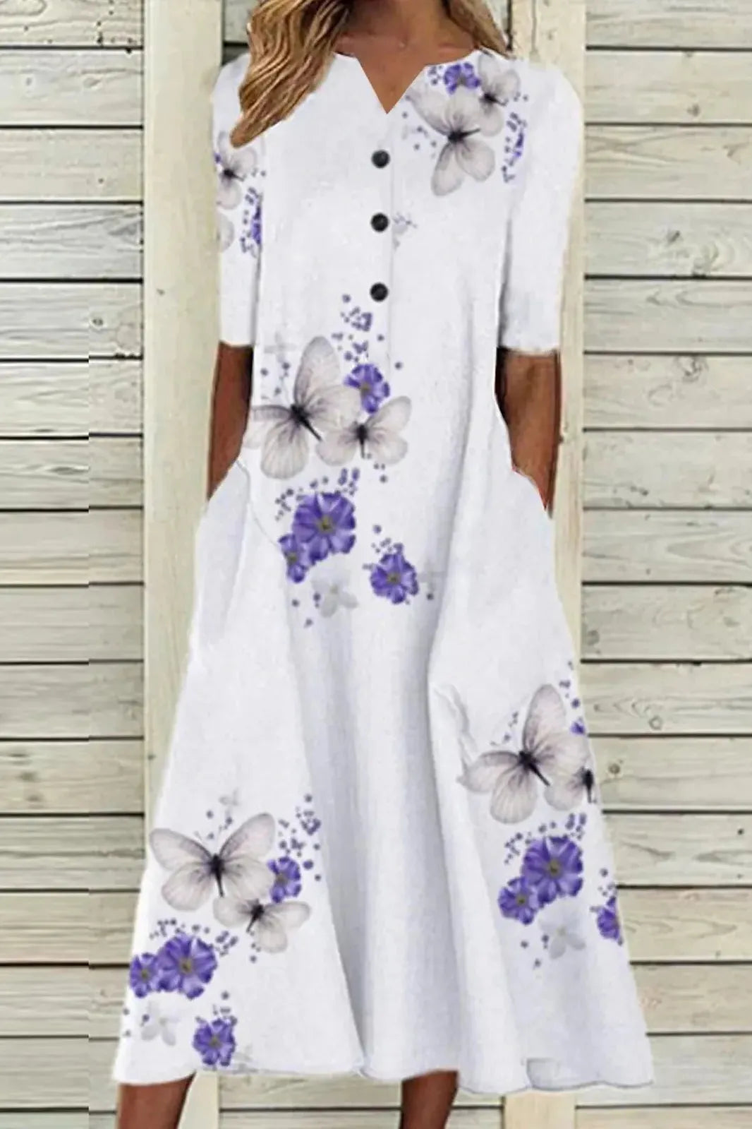 Women's elegant midi dress, belted for waist definition. Ideal formal or party dress, suitable for summer events.
