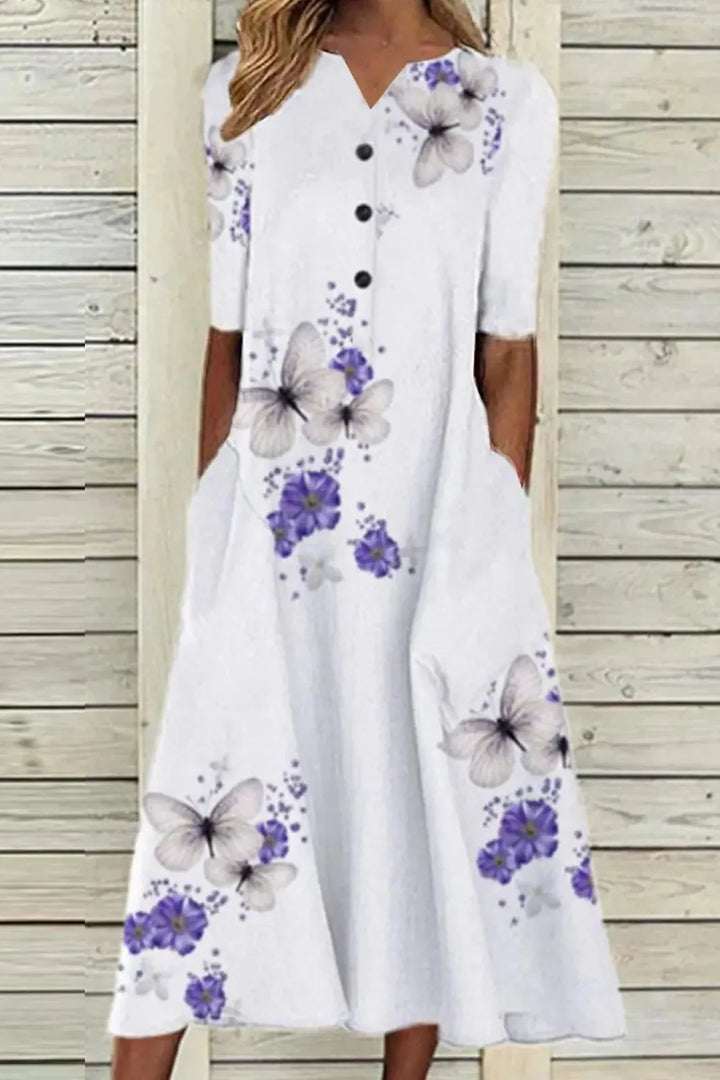 Women's elegant midi dress, belted for waist definition. Ideal formal or party dress, suitable for summer events.