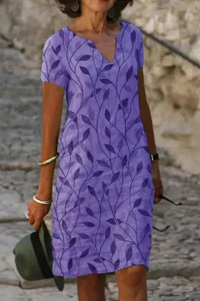 Chic women's occasion wear midi dress, featuring an elegant belt for a sophisticated and modern look.