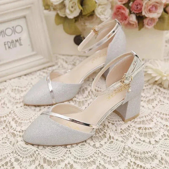Elegant women's black ankle strap block heel pumps, comfortable and perfect for formal events.