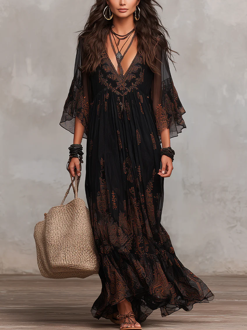 Elegant women's black boho maxi dress with flowing flutter sleeves and delicate lace details, perfect for summer or evening.