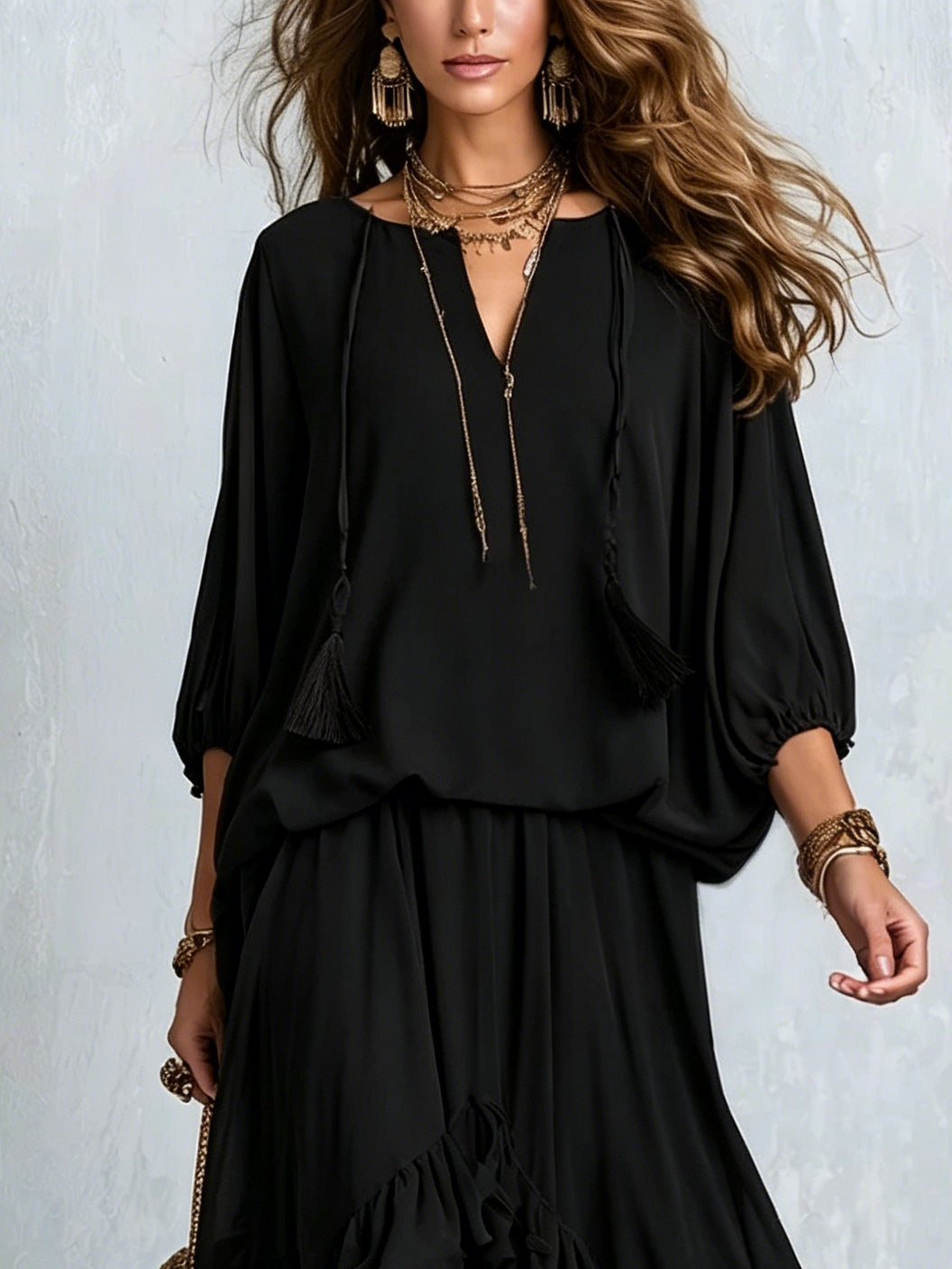 Black boho maxi skirt set: elegant V-neck top with tassels & a long, ruffled tiered skirt. Women's special occasion wear.