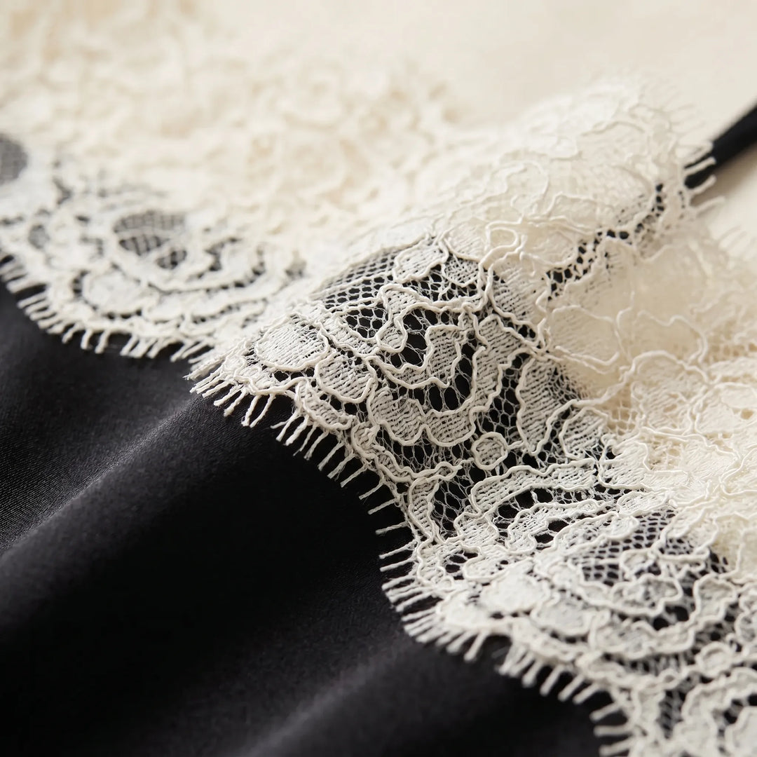 Stylish women's beige camisole with intricate lace trim, a comfortable regular fit sleeveless top.