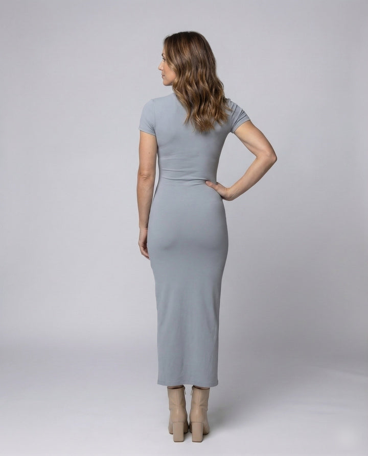Close-up of the crew neck and short sleeve detail on a women's elegant bodycon maxi dress, a summer fashion staple.