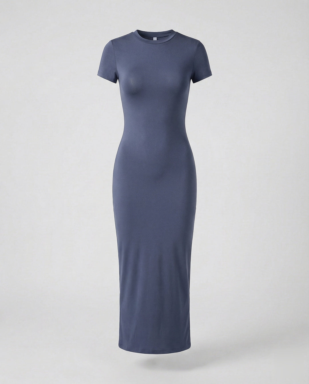 Detail of the maxi length hem on a women's elegant crew neck short sleeve bodycon dress, a summer fashion essential.