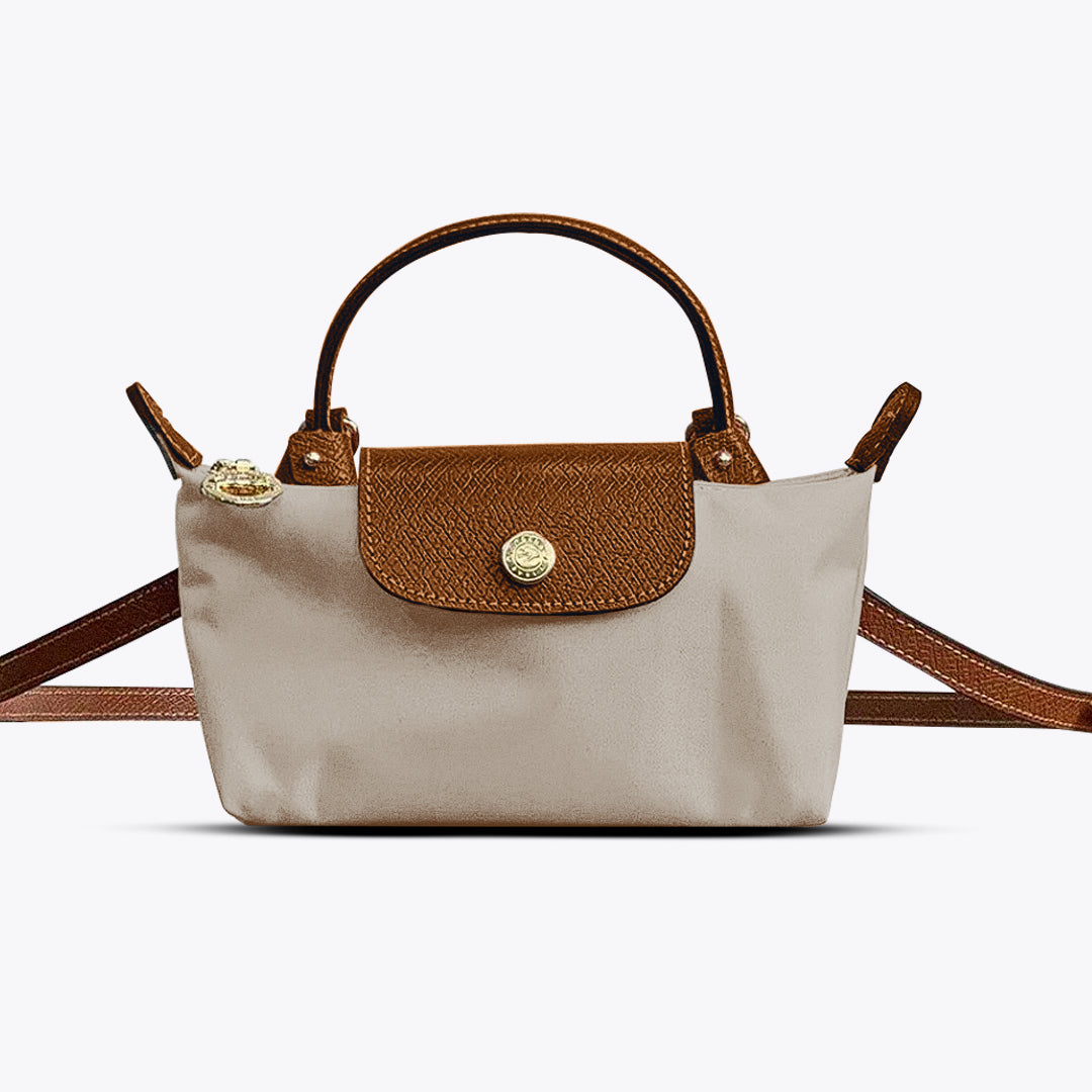 Stylish women's mini leather crossbody bag in black, featuring an elegant design and practical adjustable shoulder strap.